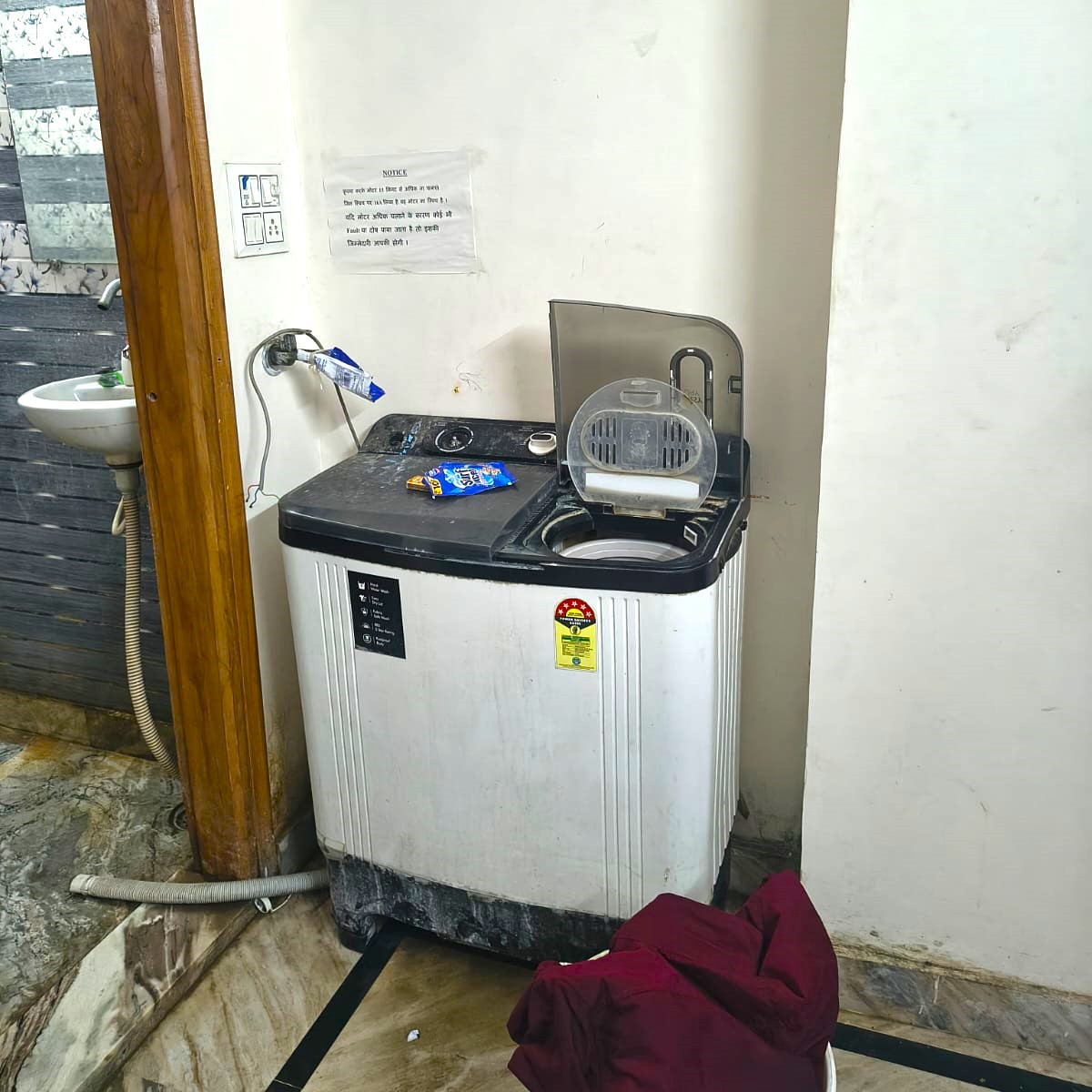 Spacious and clean bathroom with modern fixtures and good lighting in PG accommodation