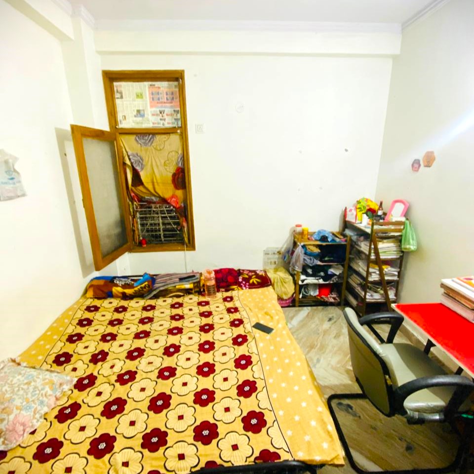 Well-maintained common area with sofa, TV and recreational space for residents