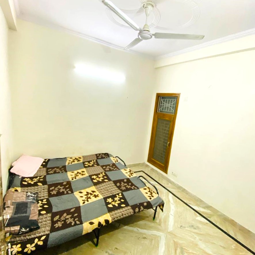 Spacious and clean bathroom with modern fixtures and good lighting in PG accommodation