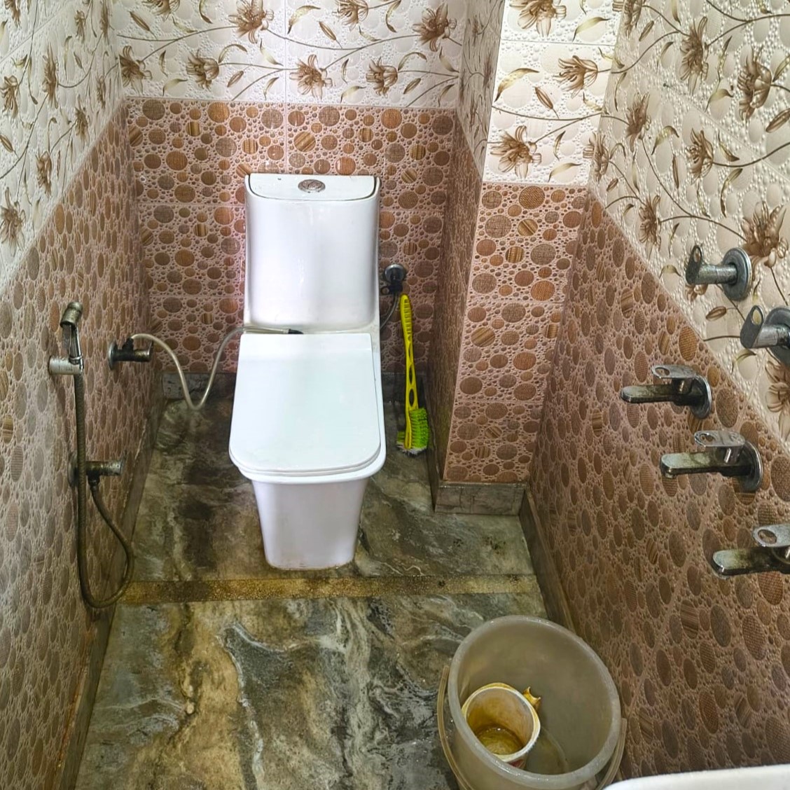 Outdoor seating area with garden view for residents to relax and socialize in fresh air