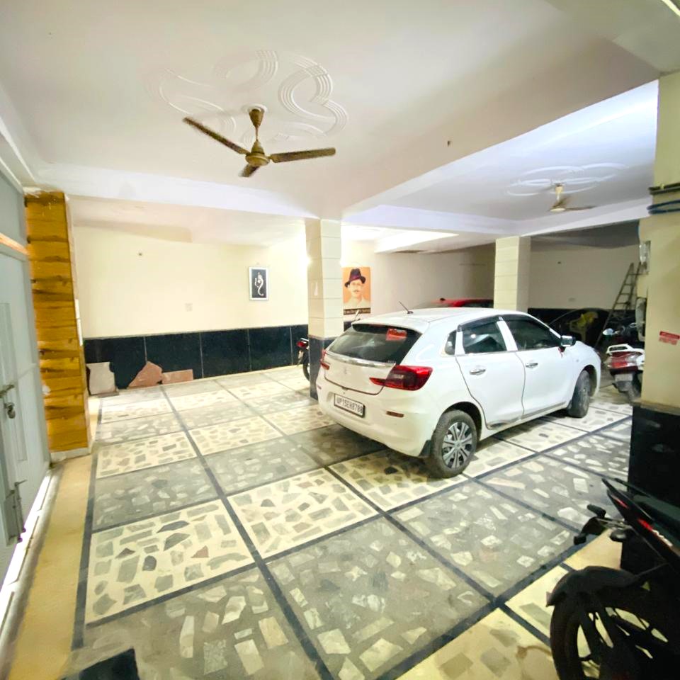 Well-maintained common area with sofa, TV and recreational space for residents