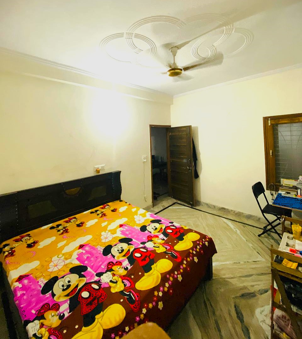 Modern PG accommodation building exterior with clean architecture and welcoming entrance